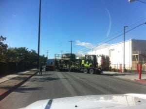 A truck is parked on the side of the road.