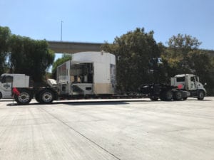 A large truck parked in the middle of a parking lot.