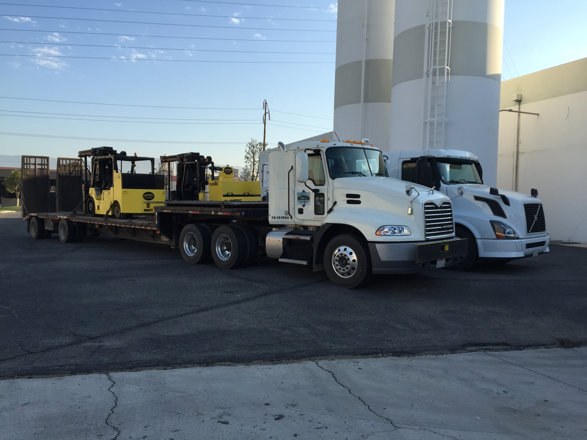 A truck is parked next to another truck.