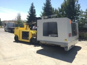 A large yellow and white truck parked in the parking lot.