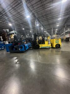 Warehouse with forklift and industrial equipment.
